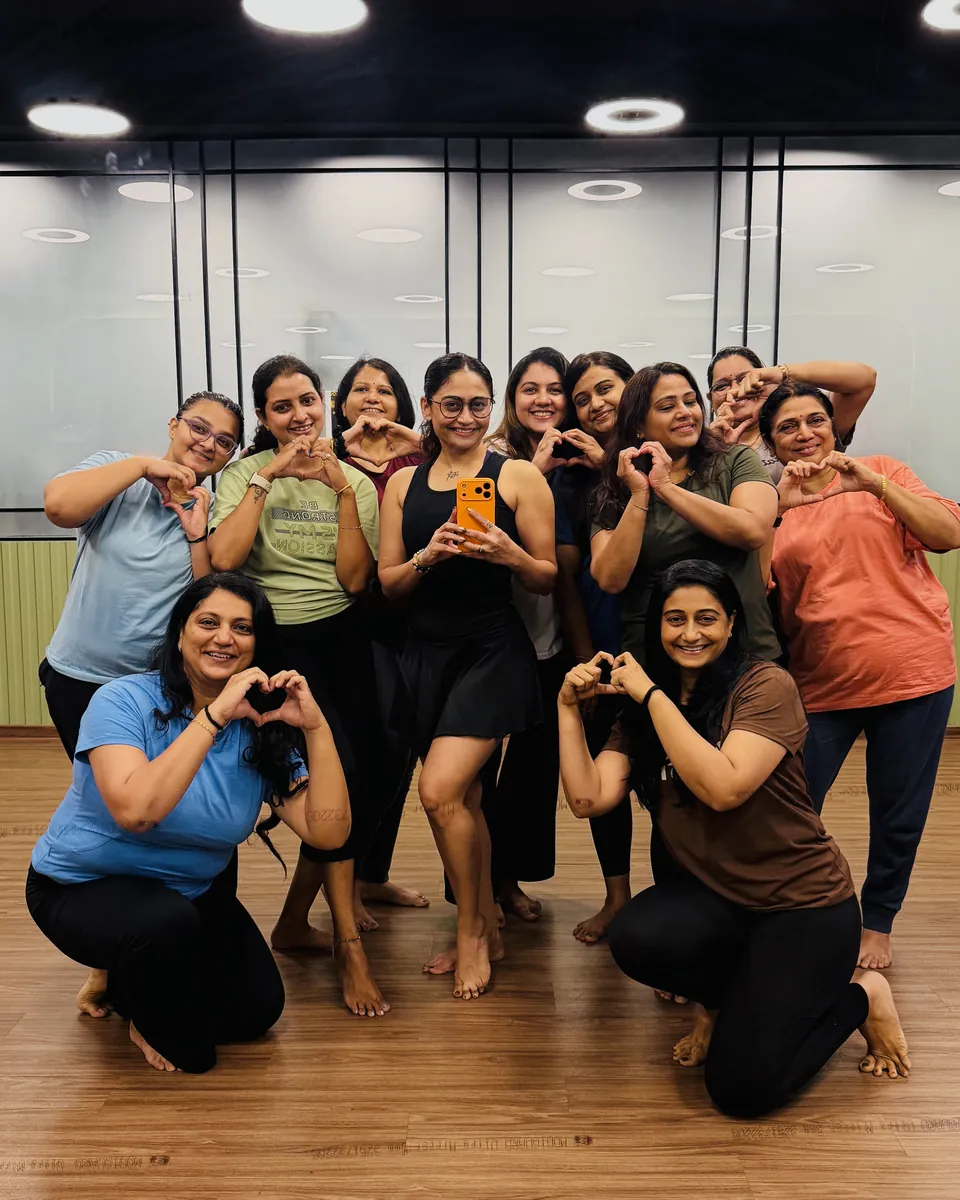 Fitjiyo members making heart signs in the group studio